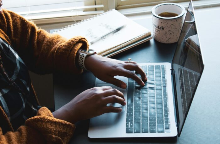 Close up of a woman typing